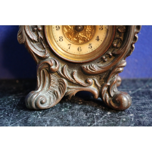 222 - Aged Metal Ornate British United Clock Company Clock, 10cm Tall