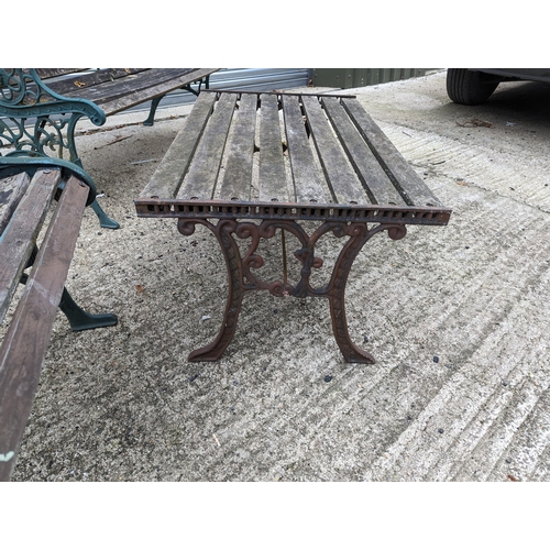 104 - 2 Aged Wooden Garden Benches & Table with Wrought Iron Scroll Ends