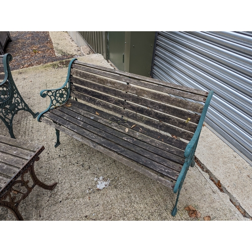 104 - 2 Aged Wooden Garden Benches & Table with Wrought Iron Scroll Ends