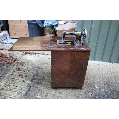 17 - Vintage Singer sewing machine with cabinet