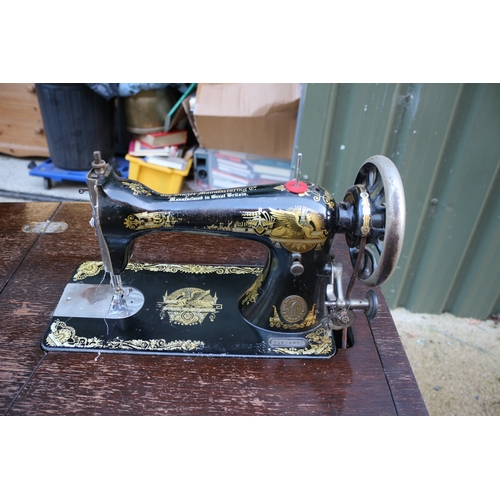 17 - Vintage Singer sewing machine with cabinet