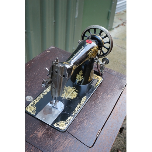 17 - Vintage Singer sewing machine with cabinet