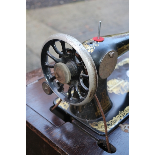 17 - Vintage Singer sewing machine with cabinet