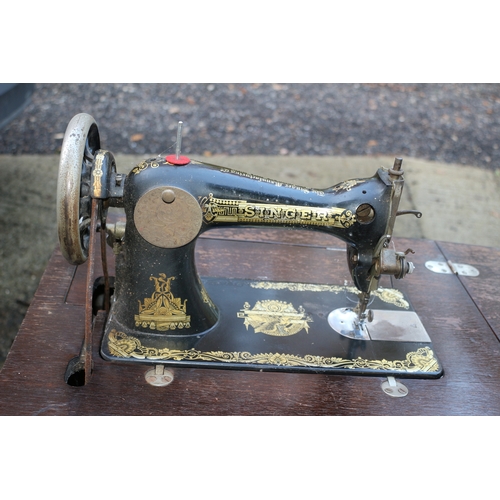 17 - Vintage Singer sewing machine with cabinet