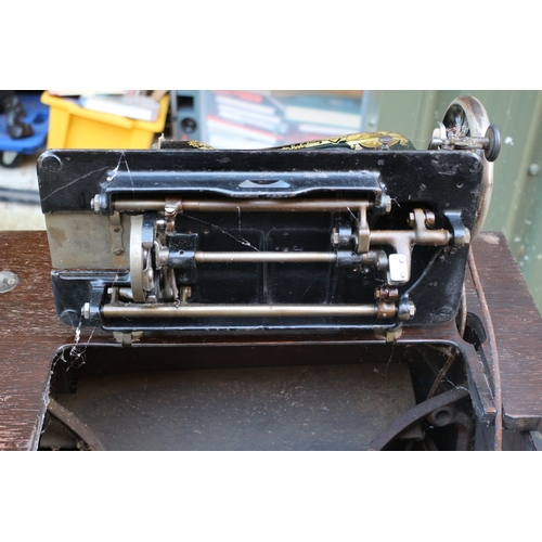 17 - Vintage Singer sewing machine with cabinet