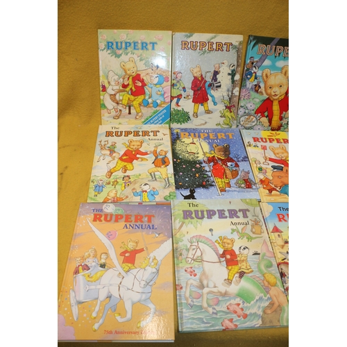 13 - Large Bundle of Rupert Bear Annuals, Comics, VHS Tape, Pin Badge & Other