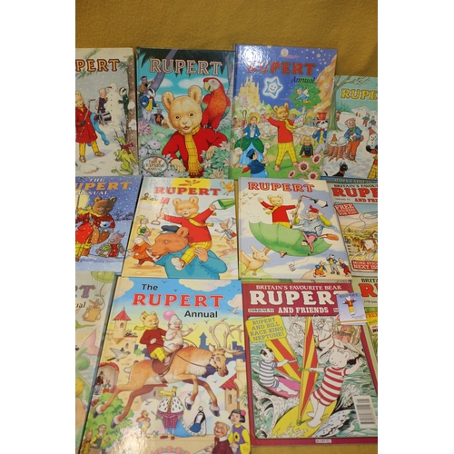 13 - Large Bundle of Rupert Bear Annuals, Comics, VHS Tape, Pin Badge & Other