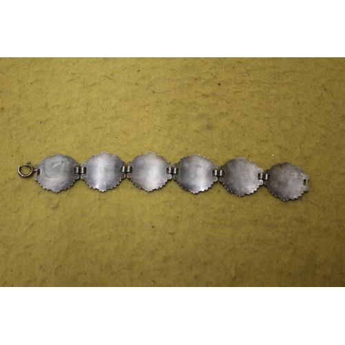 100 - White Metal Bracelet with 6 Images