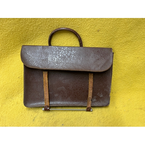 547 - Vintage leather satchel with hook over securing metal bar