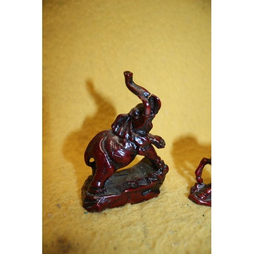 48 - Red Resin Elephant with Raised Trunk and Horse - Tallest 10cm