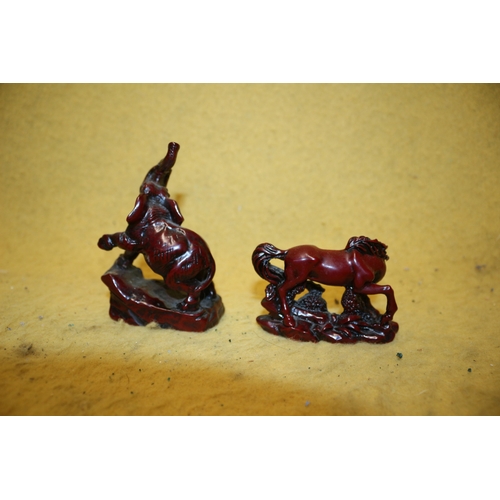 48 - Red Resin Elephant with Raised Trunk and Horse - Tallest 10cm