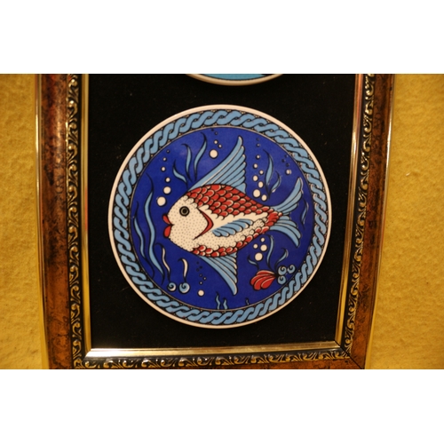 191 - 2 x Framed Pottery Tiles with Ship and Fish Scenes - 45 x 27cm