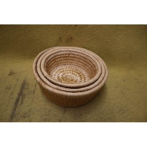 575 - Graduated Set of Woven Baskets - Largest is 28cm dia