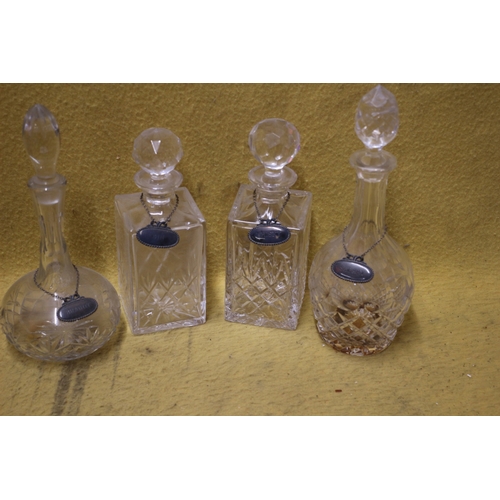 176 - 4 x Decanters with White Metal Swing Tags