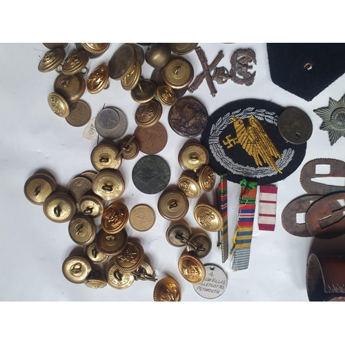 104 - A collection of militaria and coins.