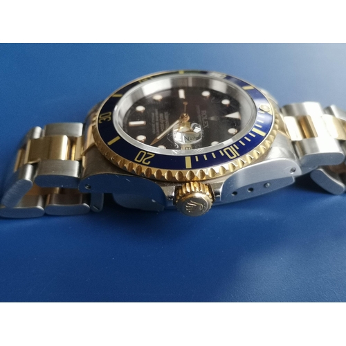 155 - A boxed gent's stainless steel & gold Rolex Oyster Perpetual Date Submariner Model 16613, having dar... 