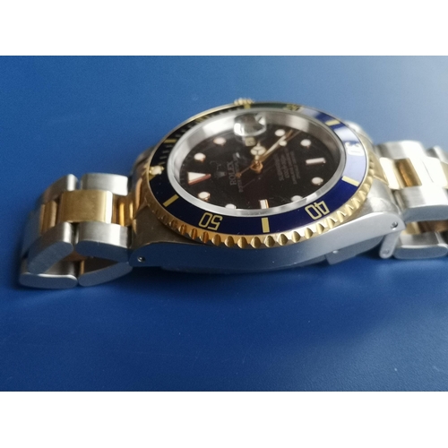 155 - A boxed gent's stainless steel & gold Rolex Oyster Perpetual Date Submariner Model 16613, having dar... 