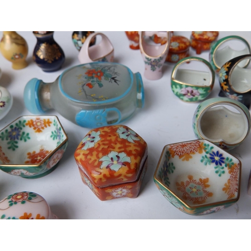 35 - A collection of 20thC miniature Oriental porcelain vases and baskets together with a Chinese interna... 