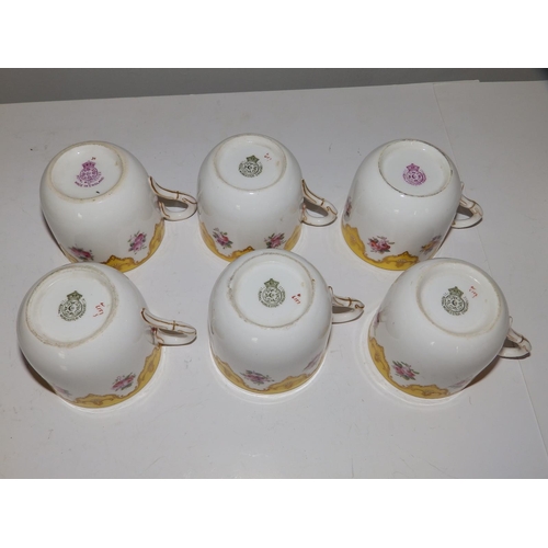 43 - An early 20thC Royal Worcester 19 piece tea set, decorated roses with yellow & gold borders in patte... 