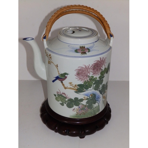 46 - A large 20thC Chinese porcelain cylindrical teapot with cane bound swing handle,  9.5