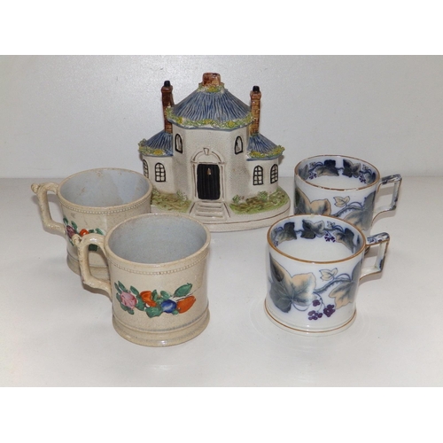 52 - A Victorian Staffordshire cottage pastille burner, a pair of Victorian Davenport ivy wreath mugs and... 