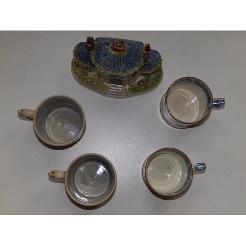 52 - A Victorian Staffordshire cottage pastille burner, a pair of Victorian Davenport ivy wreath mugs and... 