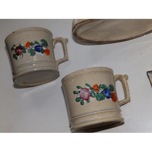 52 - A Victorian Staffordshire cottage pastille burner, a pair of Victorian Davenport ivy wreath mugs and... 