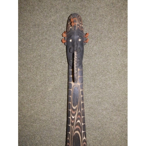 76 - A Papua New Guinea ceremonial paddle, 56