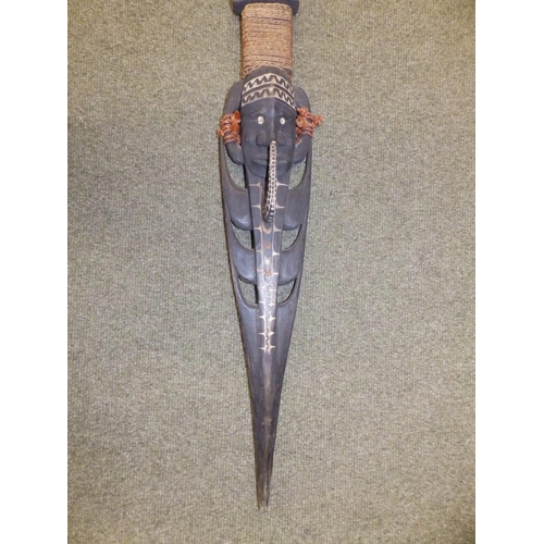 76 - A Papua New Guinea ceremonial paddle, 56