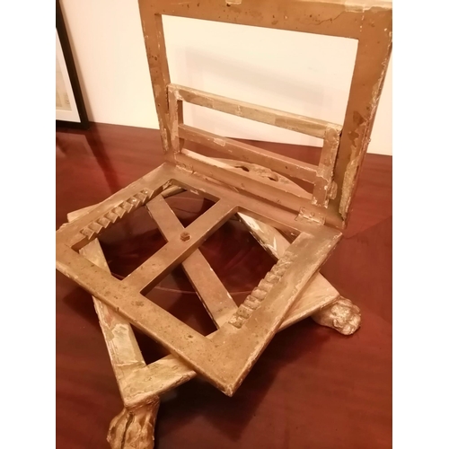 79 - A 19thC giltwood bible stand, of low rectangular form on four paw feet - believed to have originated... 