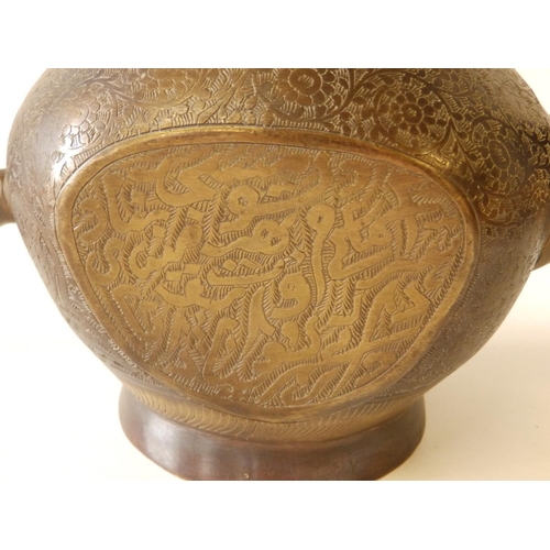 80 - A Persian bronze coffee pot with overall engraved decoration of scrolls and script, 11