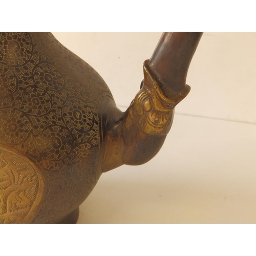 80 - A Persian bronze coffee pot with overall engraved decoration of scrolls and script, 11