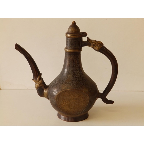 80 - A Persian bronze coffee pot with overall engraved decoration of scrolls and script, 11