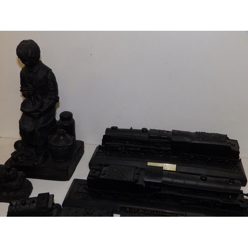 85 - A collection of modern ornaments made using British coal, including model locomotives.