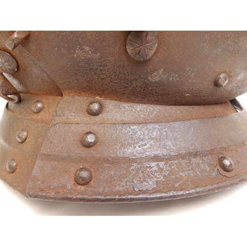 88 - An antique close helm with roped comb, 13.5