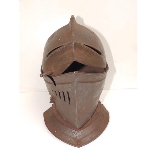 88 - An antique close helm with roped comb, 13.5