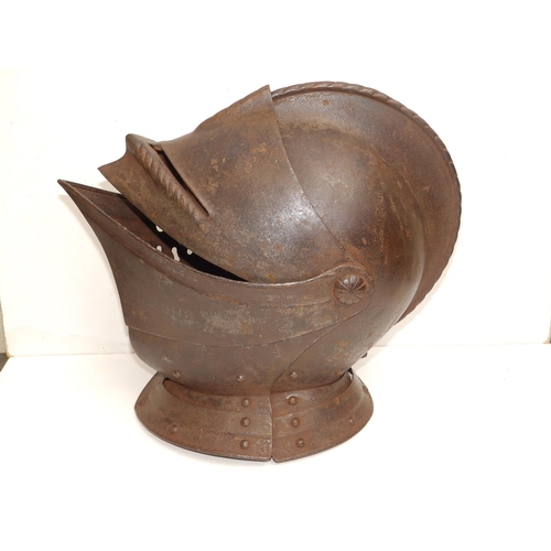 88 - An antique close helm with roped comb, 13.5