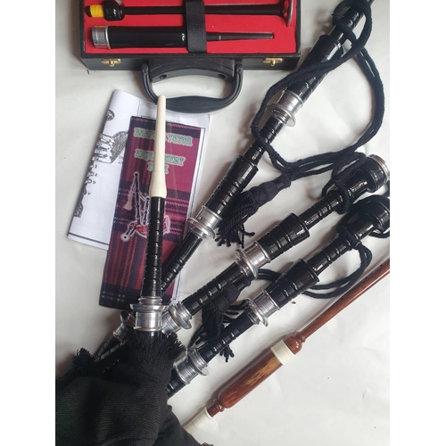 95 - A set of bagpipes and other accessories.