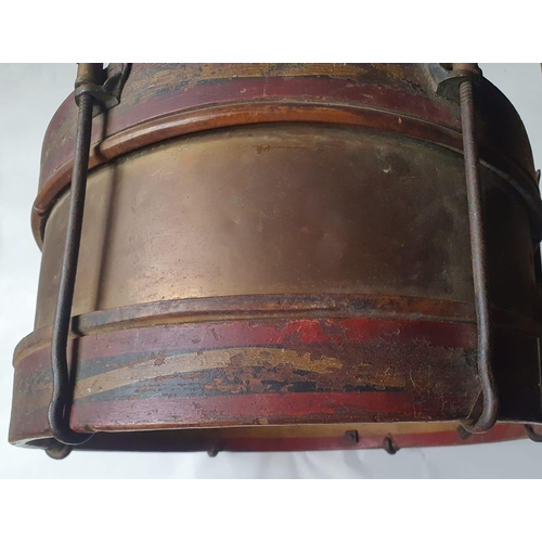 96 - An antique brass-mounted wooden drum with painted decoration, 15.5