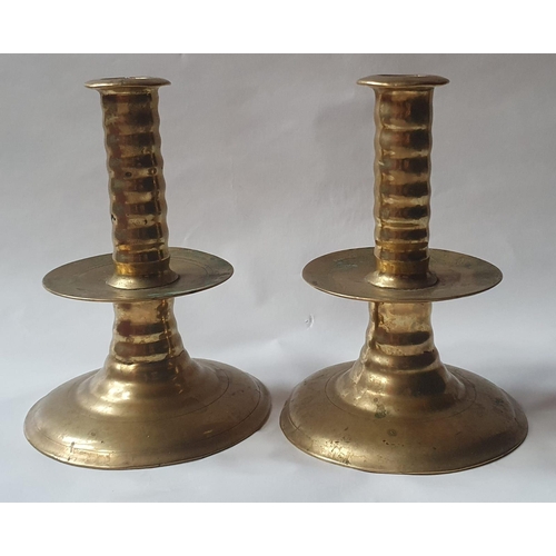 97 - A pair of 17thC brass trumpet base candlesticks, each inscribed on the base with owner's initials, 5... 