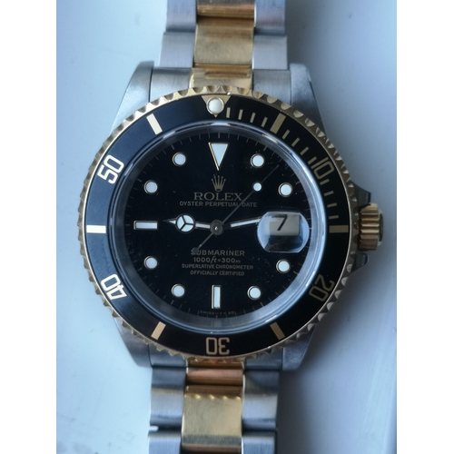 156 - A boxed gent's gold & stainless steel Rolex Oyster Perpetual Date Submariner Model 16613, having bla... 