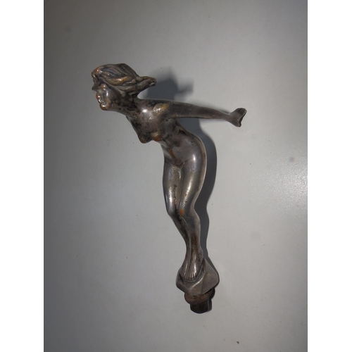 113a - A car mascot modelled as a nude female leaning into the wind - 'Reg'd. Des.', 6.75