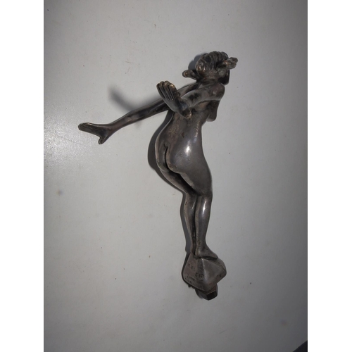 113a - A car mascot modelled as a nude female leaning into the wind - 'Reg'd. Des.', 6.75