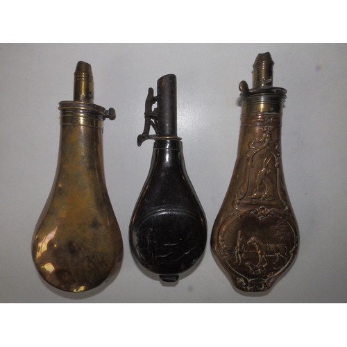 118 - Two brass shot flasks and a leather flask, the largest 8.5