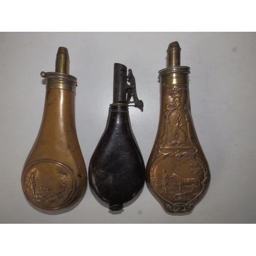 118 - Two brass shot flasks and a leather flask, the largest 8.5