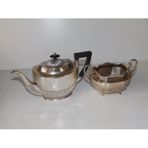 138 - A small oval Birmingham silver half-reeded teapot,  8