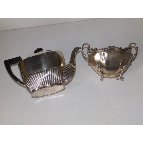 138 - A small oval Birmingham silver half-reeded teapot,  8