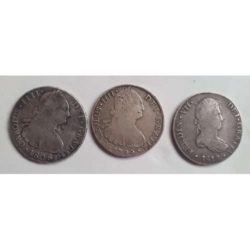 243 - Three Spanish Colonial silver 8 Reales coins.