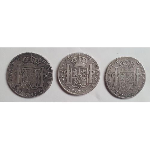 243 - Three Spanish Colonial silver 8 Reales coins.