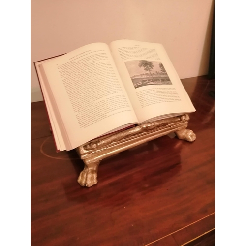 79 - A 19thC giltwood bible stand, of low rectangular form on four paw feet - believed to have originated... 